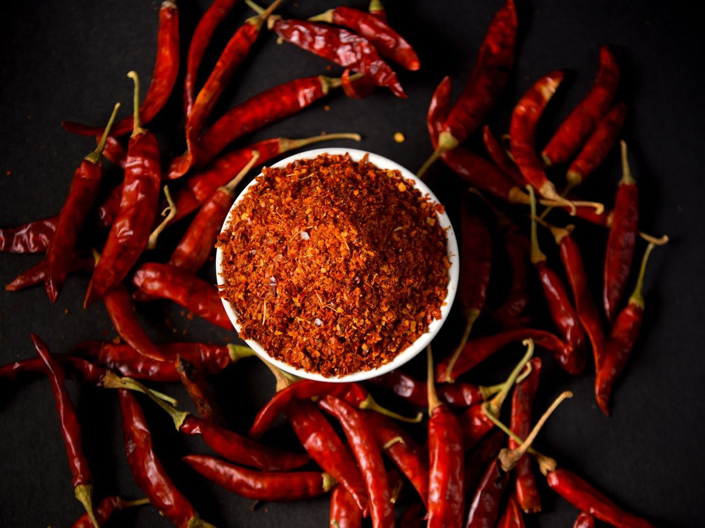 Ground chilli blend surrounded by dried red chillies